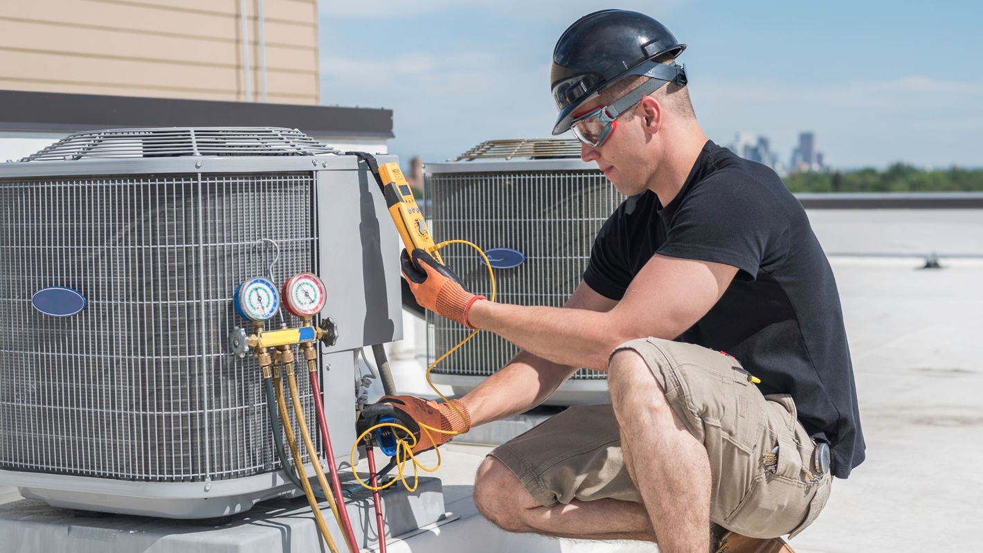 A professional repairing an HVAC system