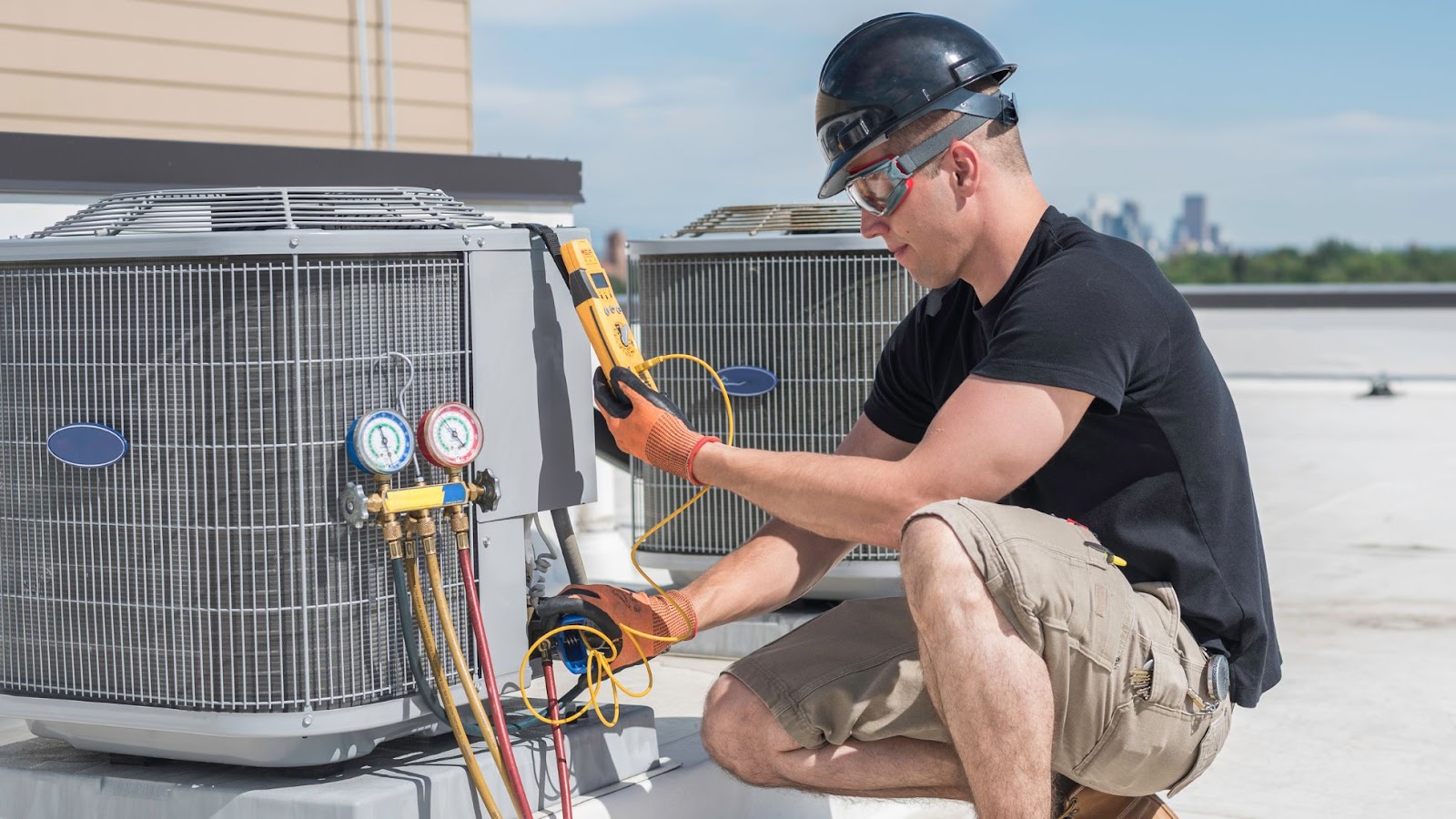 A technician busy inspecting an HVAC unit.
