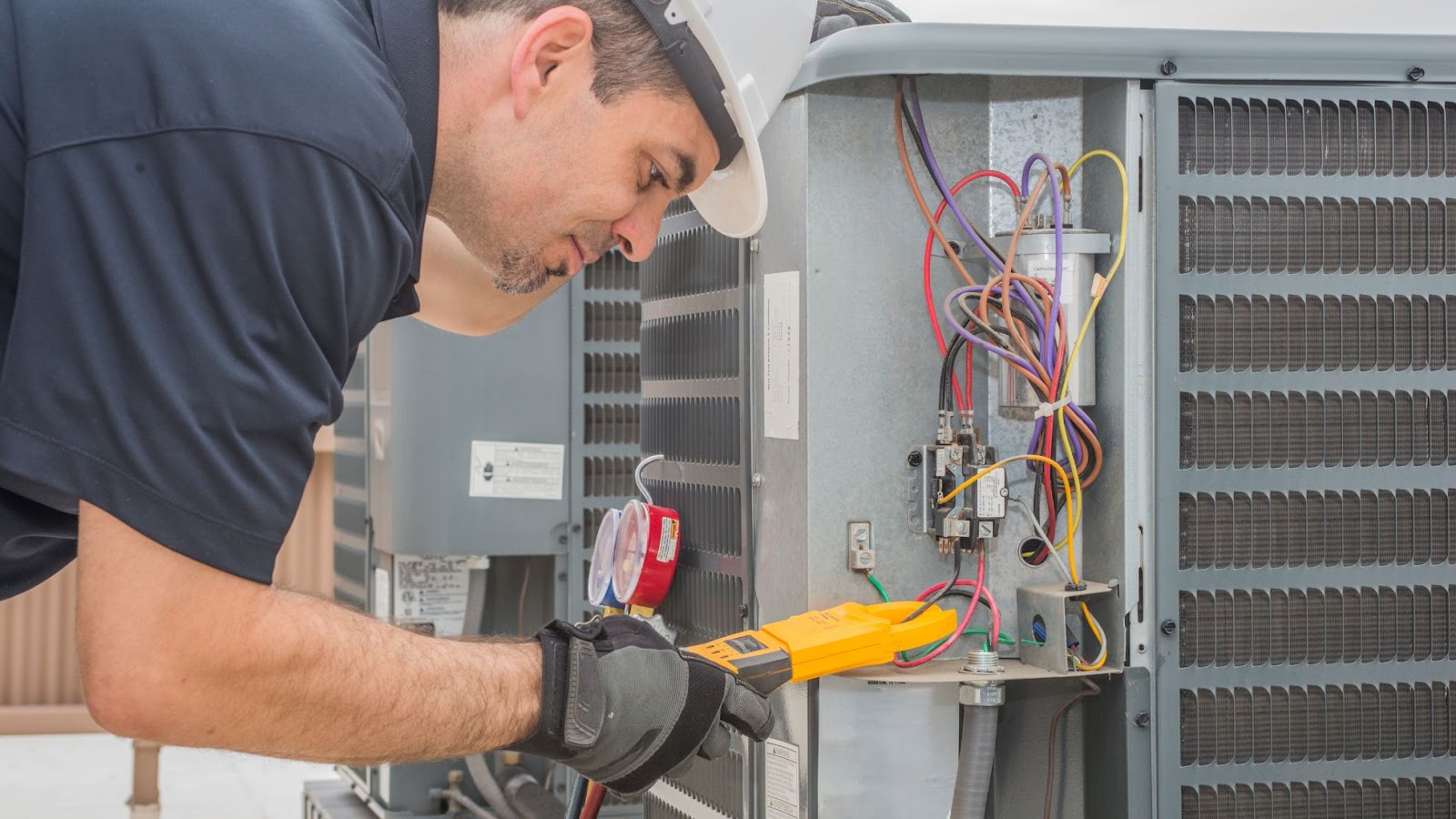 HVAC Technician working on an AC unit.
